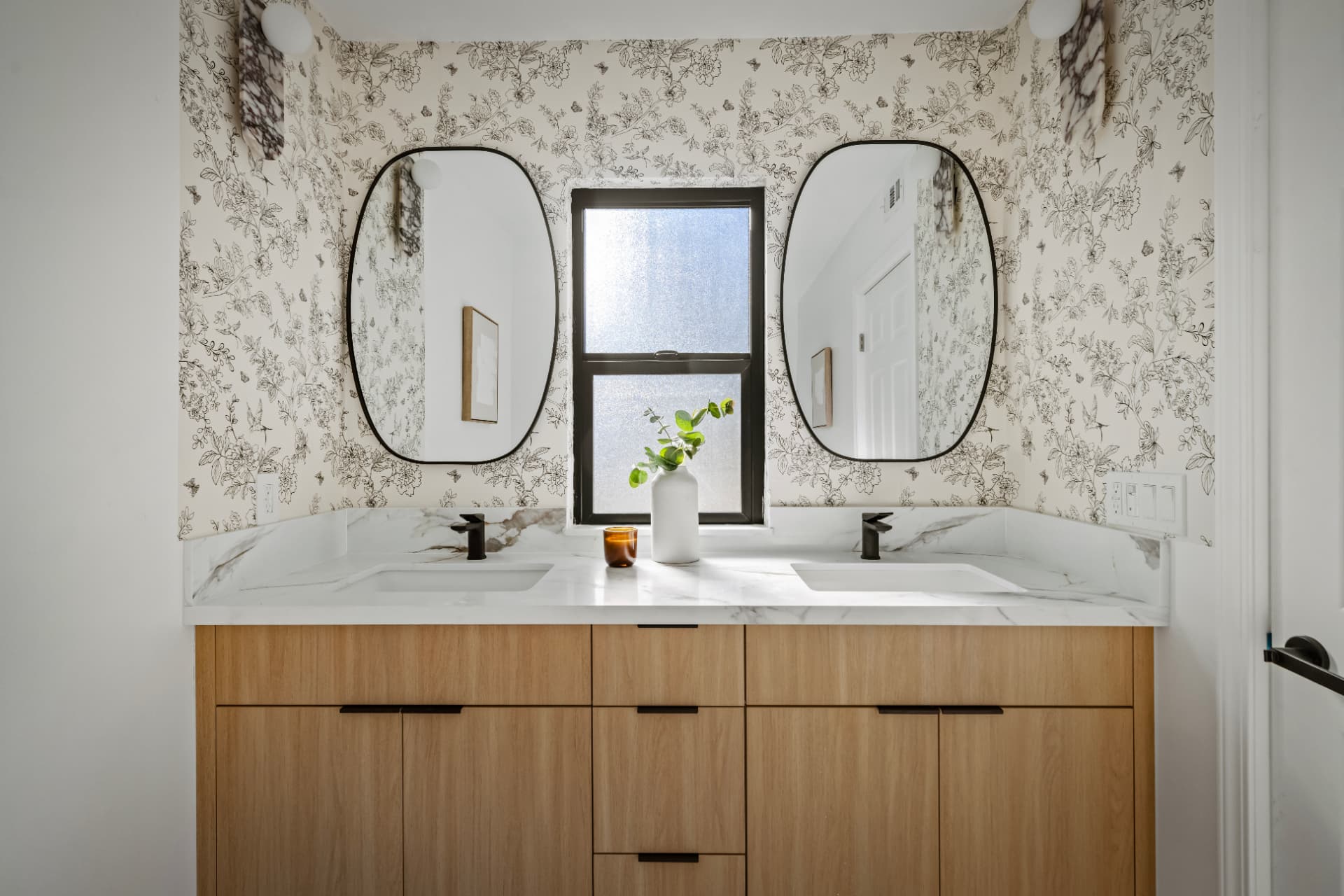 Dual-vanity ensuite bath with patterned wallpaper
