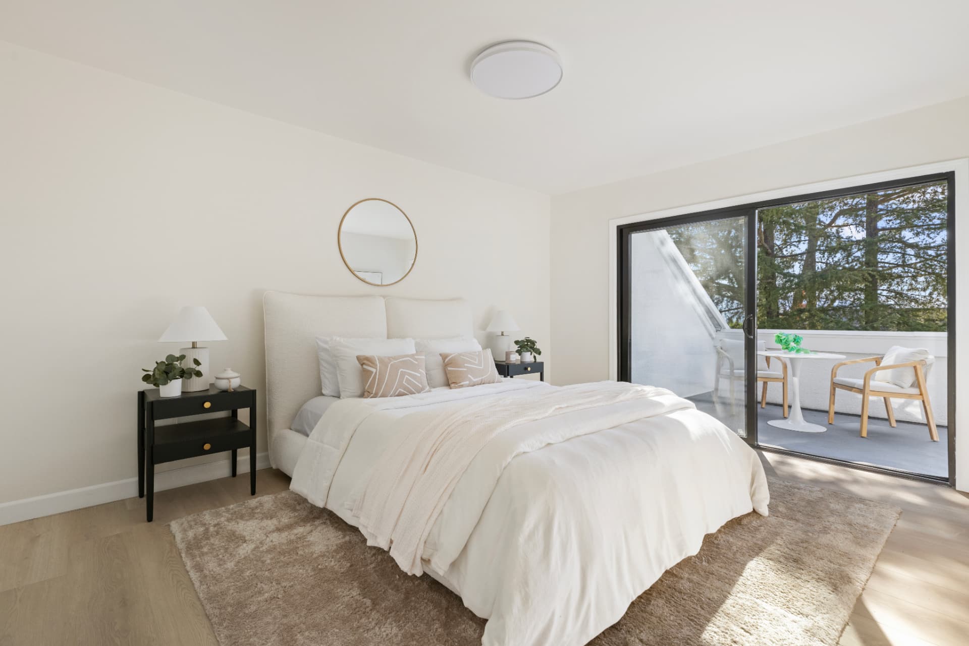 Primary bedroom with sliding glass doors to a private deck