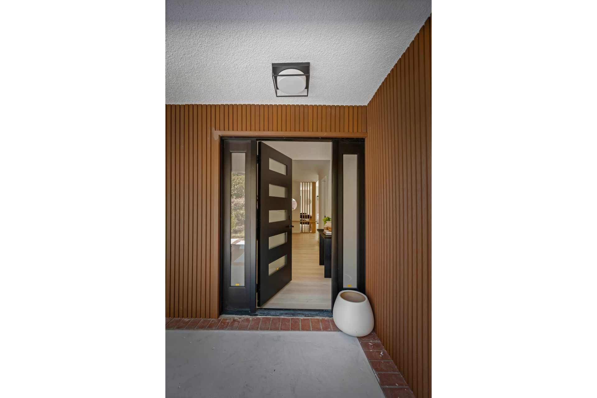 Open front door looking into the light-filled entry