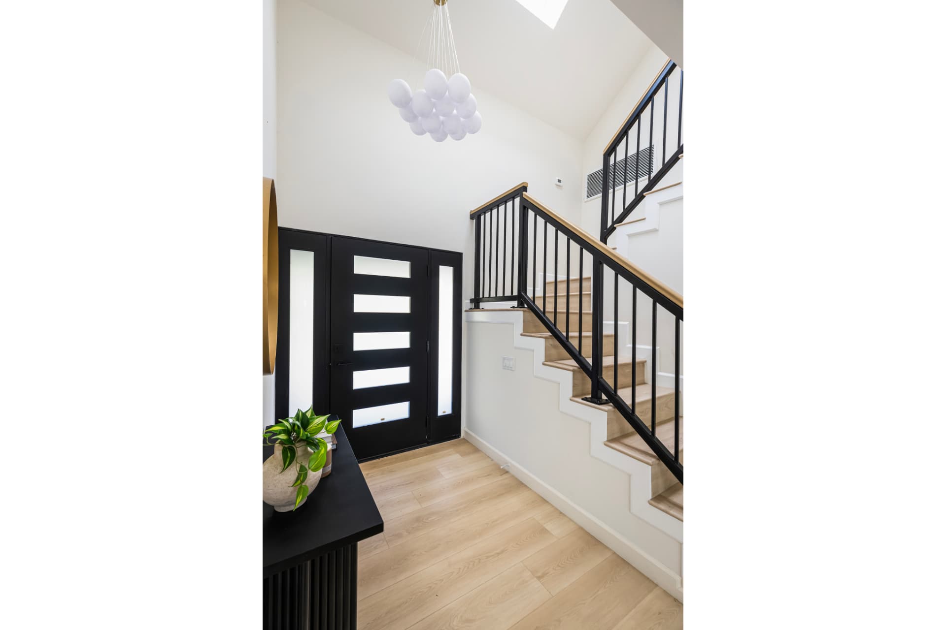 Entry stair hall with skylight above